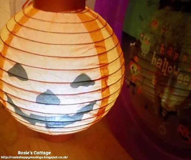 Our first attempt at Halloween decor and holiday smiles included this little battery powered paper lantern :)