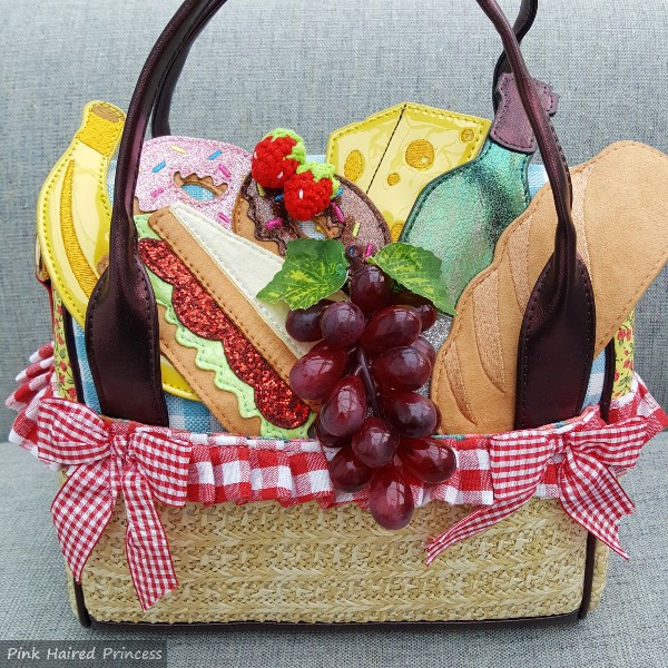 picnic basket themed handbag with food and gingham trims