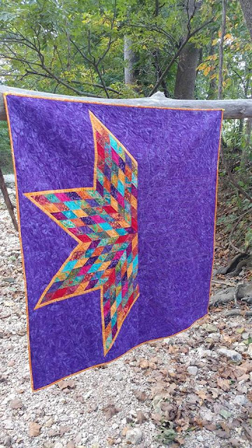 Scrappy Lonestar quilt using Empress Garden fabrics by Island Batik