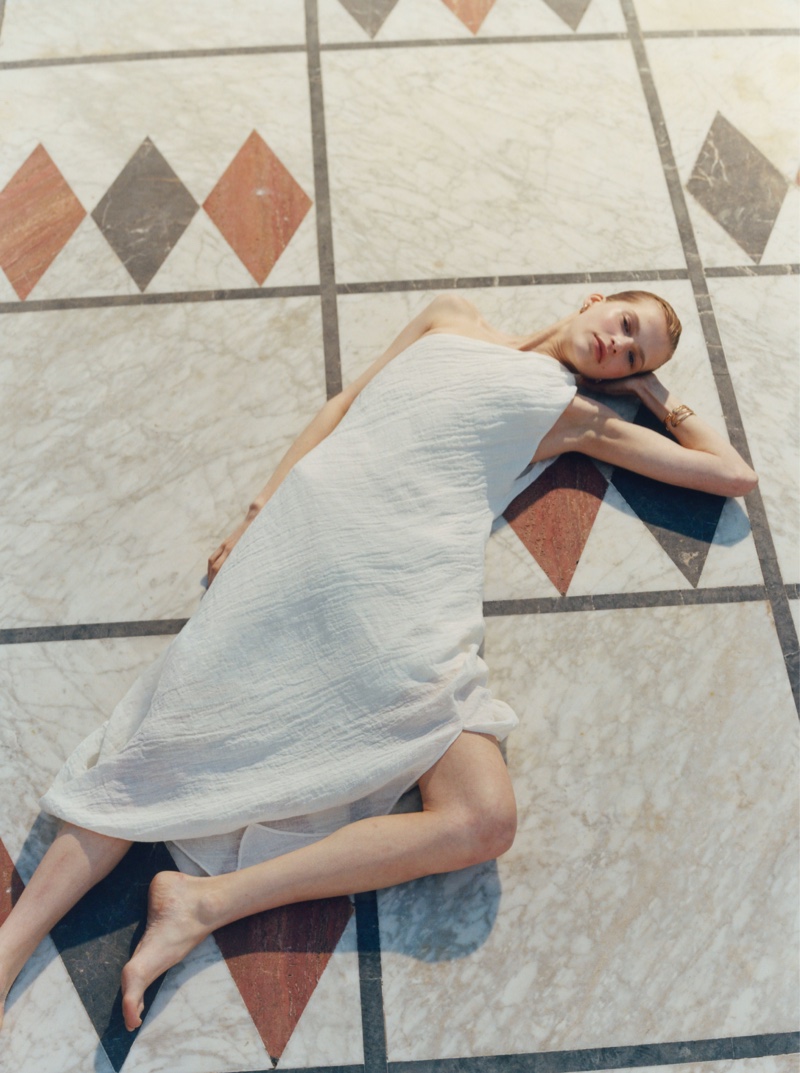 Model Aivita Muze dons an asymmetrical waffle-knit dress from Massimo Dutti