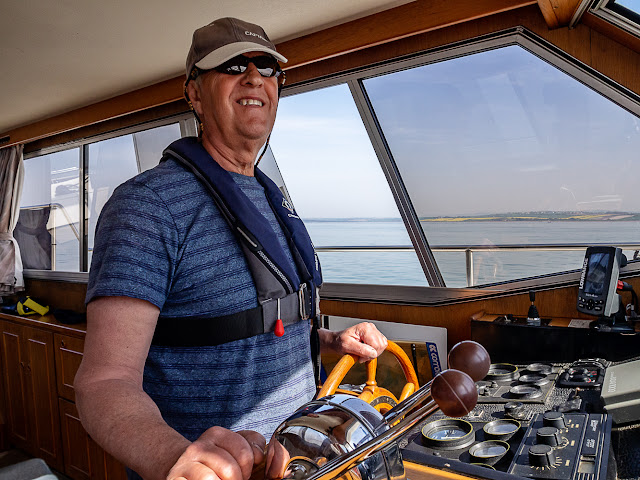 Photo of Phil at the helm of Ravensdale