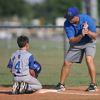 coach and baseball kid