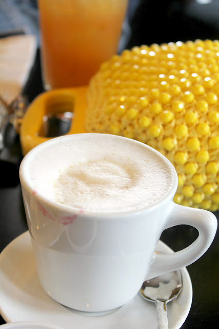 cappuccino and lipstick on cup + vintage yellow purse