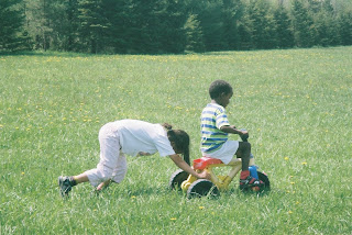 Mustang and Button enjoying the baby bike