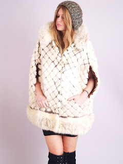 Vintage 1960's white mink fur cape with diamond pattern design and front pockets.