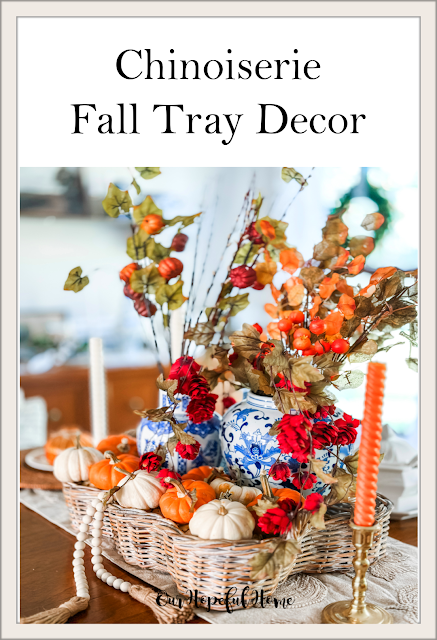 wicker basket filled with mini pumpkins on dining room table