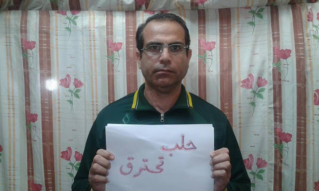 Khalid Hardani Iranian political prisoner send a photo from jail, in solidarity with Syrian people 