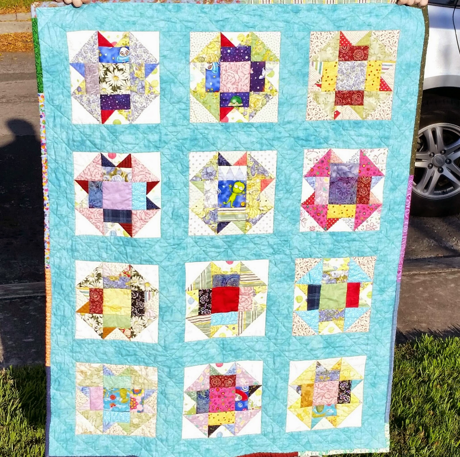 http://aquiltingchick.blogspot.com/2015/01/scrappy-baby-quilt-finish.html