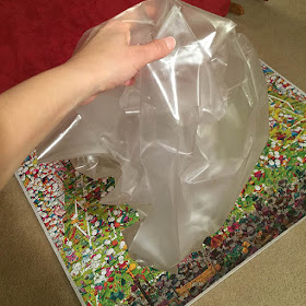 Large wad of crumpled contact paper after it was removed from the surface of a large puzzle