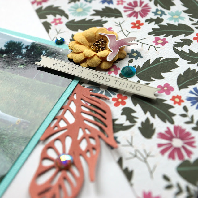 Carta Bella Wilflower cardstock, stickers; Spellbinders Feathers in the Wind die cut; Prima Marketing Zella Teal say it in crystals, Guava flowers; Scrapbook.com Magic Mat, Boho smooth cardstock