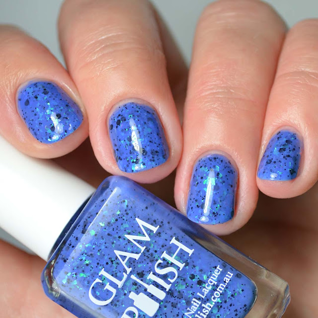 blue nail polish with color shifting flakies four finger swatch