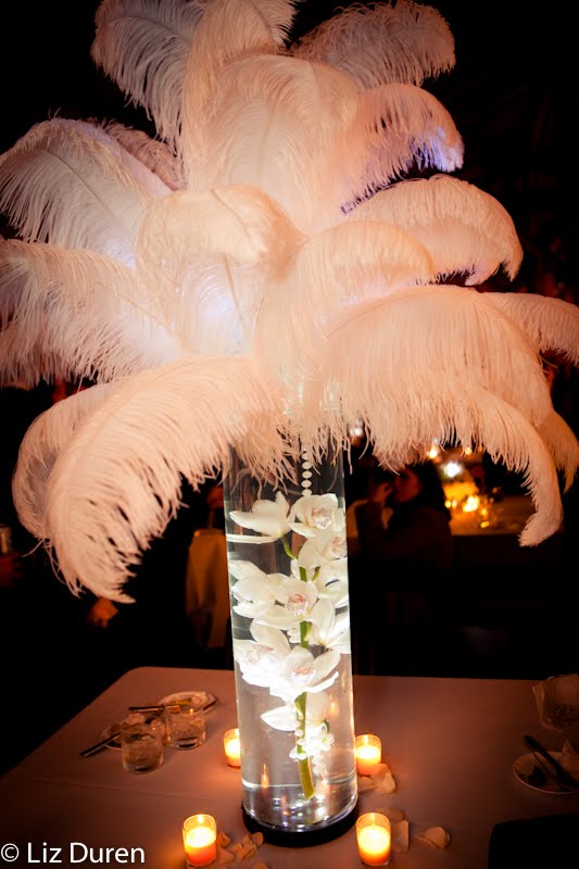 The table centerpieces were topped with huge white feathers perfect for a