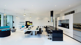 Minimalist black and white kitchen and dining room 