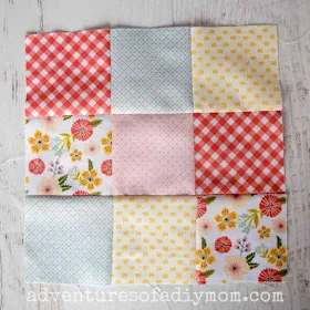 nine patch quilt block with a variety of colored fabrics