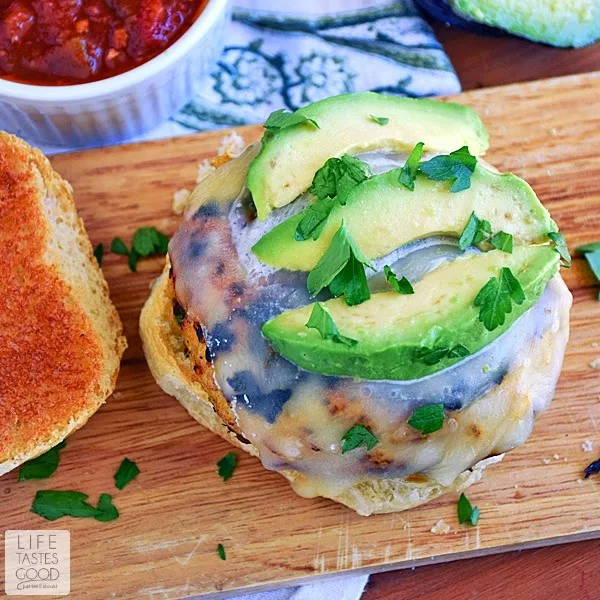 You've got to try these Spicy Chicken Burgers | by Life Tastes Good! They combine the familiar Tex-Mex tastes of jalapenos, pepperjack cheese, avocados, and salsa in a flavorful chicken burger. It's almost like eating a chicken taco, but in burger form, which makes it a thousand times better! Right?!