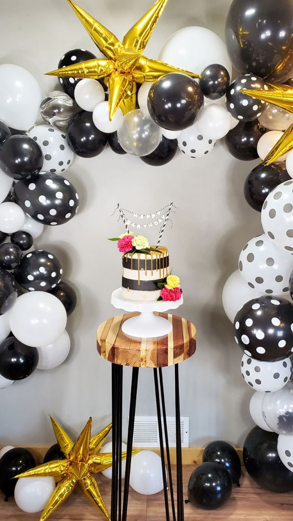 Add some balloons if desired, but really, we all know that cake is the star of the show.     This easy resin cake topper is a great way to add a custom saying, age number or even an inside joke to the cake in a very professional looking way.