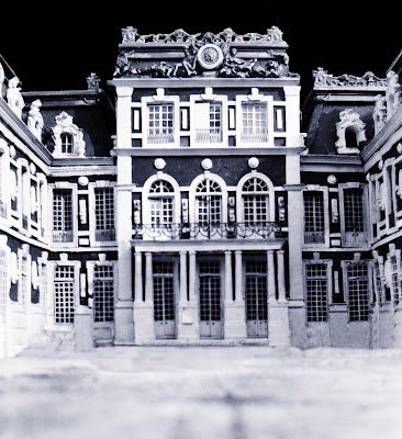 b/w image of Versailles 1/48 Palace Model with glazed windows, doors, roof decor, railings.