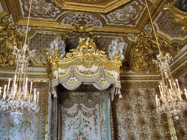 A bedroom with beautiful decorations in Palace of Versailles