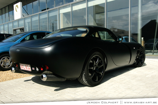 It's a TVR Tuscan MK1 with left hand drive with matte black paint (but I 