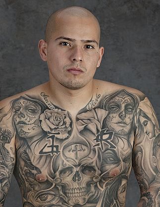  largescale portraits of individuals boasting Chicano tattoos