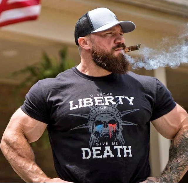 Super muscular bearded dude on roids smoking a cigar