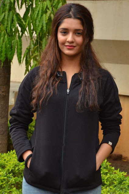 Ritika Singh exudes coolness in a black outfit, showcasing her stylish and confident demeanor.