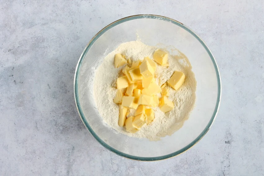 Flour and butter in mixing bowl