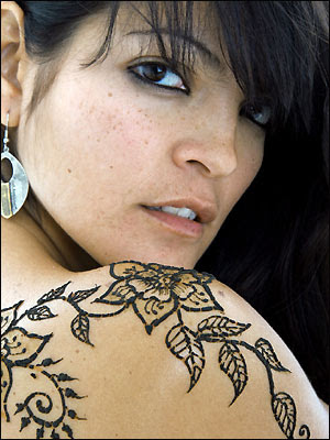 black henna tattooed on shoulder girls