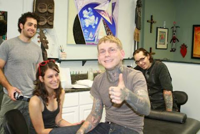 A Guy Gets His Face Tattoed