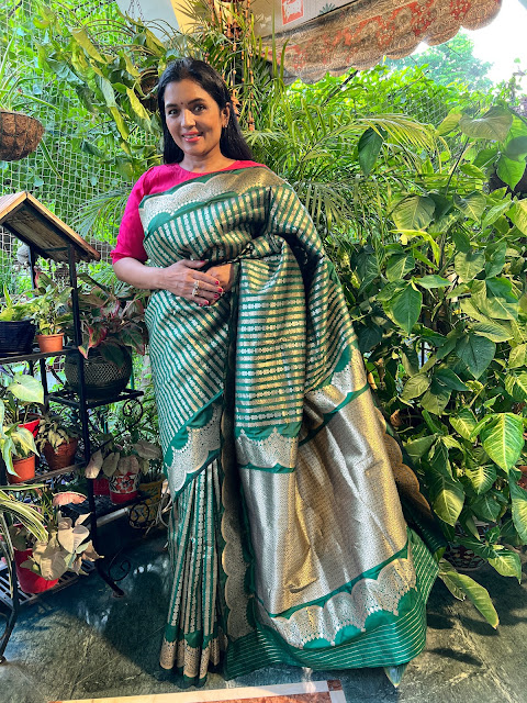 Emerald green Banarasi silk saree with a scallop border