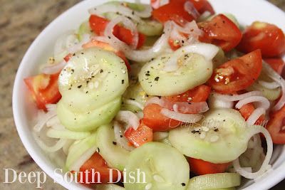 Cucumbers and sweet onions, marinated in a slightly sweetened white wine and rice vinegar dressing with mustard seeds and tossed with fresh tomatoes.