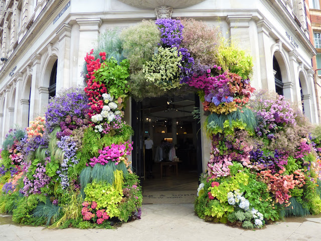 Floral arch in Sloane Square, London, for Chelsea in Bloom 2018 free flower festival