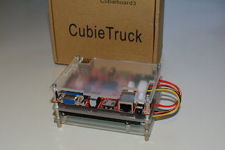 CubieTruck assembled in its clear case in front of the box it arrived in.