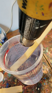 using-heat-gun-to-remove-air-bubbles-from-epoxy-HalfBakedArt