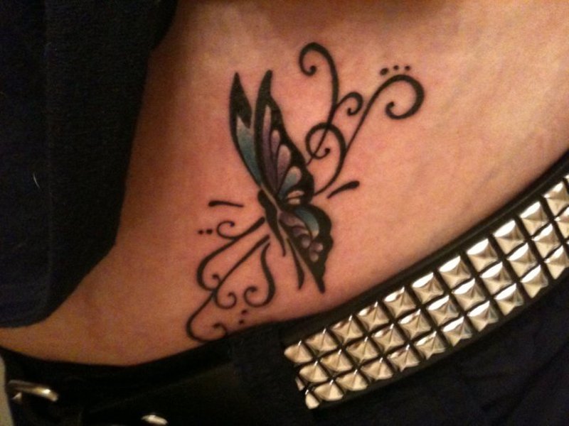 Tiny Tender Butterfly And Tribal Pattern Inked On Hip