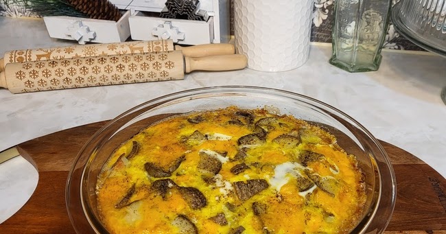 Breakfast casserole on top of wood cutting board