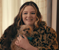 woman holding a small dog