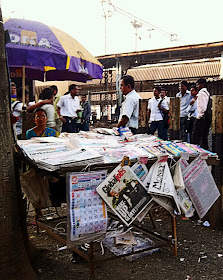 woman newspaper vendor