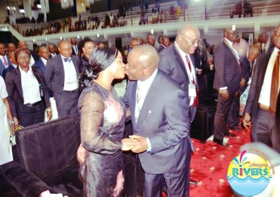 Photo of Governor Wike and wife kissing at the NBA Conference 