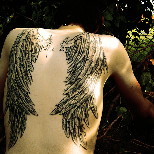 angel wing tattoos for men on back. A guy can put wings on his chest or arms. On the back is fine if its part of 