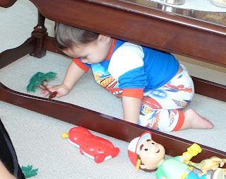 Child playing under a table