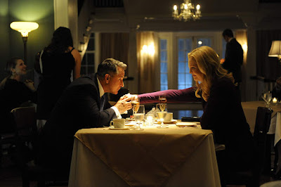 Movie still for the 2014 thriller "Stephen King's A Good Marriage" where Anthony LaPaglia kisses Joan Allen's hand while they are at dinner