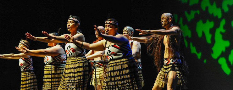 Nga Hau E Wha dancers wearing clothing with the group's swastika logo.