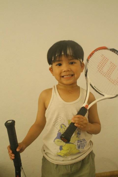 Tennis and Kids-Benefits of Playing Tennis, little boy holding tennis racquets