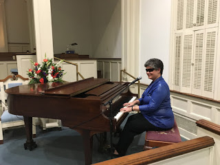 Laurel at the piano in the Village Chapel, The Village At Summerville, SC.