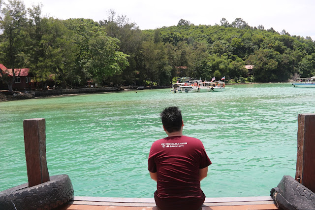 Sapi Island, pantai berpasir putih dengan air yang hiaju kebiruan