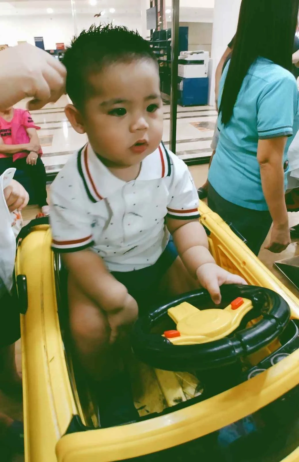 Miguel's first haircut at Cuts 4 Tots