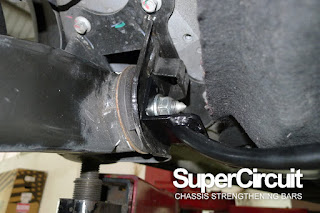 supercircuit rear lower bar installed to the chery omoda 5 rear trailing arm mounting