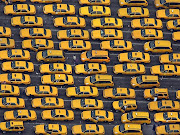 . as they wait for fares at New York's LaGuardia Airport, June 14, 2007. (yellow cabs viewed from the goodyear blimp at laguardia airport june photo by todd heisler the new york times photo archives)