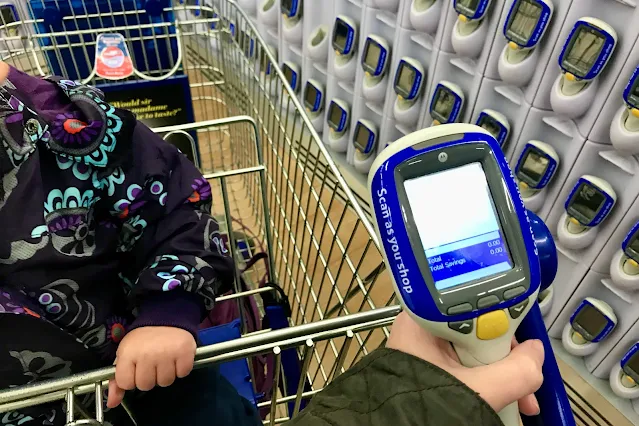 A supermarket trolley and scanner in Tesco